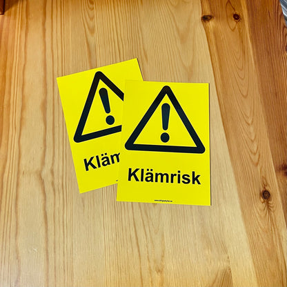 Klämrisk - Skyltar och dekaler enligt Arbetsmiljöverkets standarder och riktlinjer